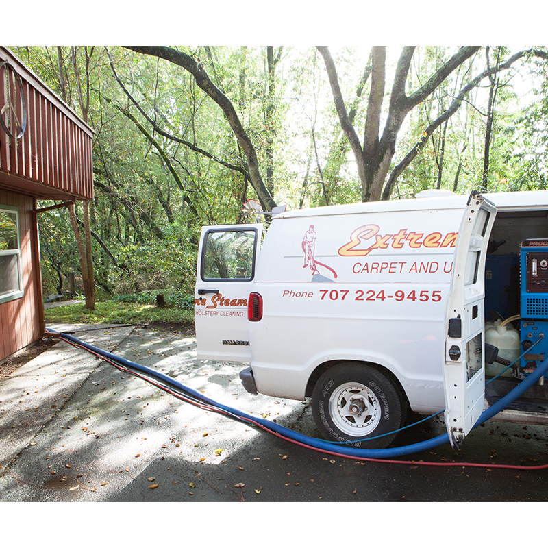 Photo of an Extreme Steam service van working on a residential job.